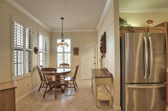 1438 Maseno Dr, Venice, FL 34292 - dining room featuring baseboards, light tile patterned floors, a chandelier, and crown molding