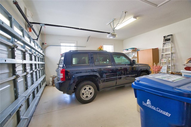1438 Maseno Dr, Venice, FL 34292 - garage featuring a garage door opener