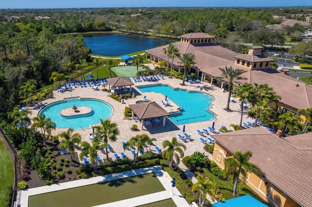 1438 Maseno Dr, Venice, FL 34292 - drone / aerial view of a pool area, a large body of water, and a forest