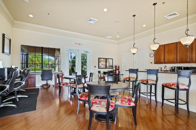1438 Maseno Dr, Venice, FL 34292 - dining area featuring crown molding, dark wood finished floors, french doors, recessed lighting, and an office area
