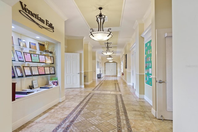 1438 Maseno Dr, Venice, FL 34292 - hallway with ornamental molding, inlaid floor details, and baseboards