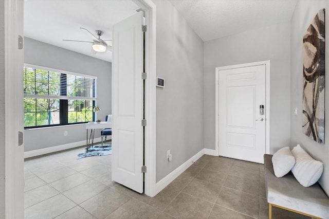 21649 Avon Park Ct, Venice, FL 34293 - tiled foyer with baseboards and a ceiling fan