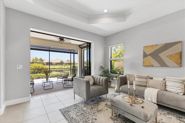 21649 Avon Park Ct, Venice, FL 34293 - living area featuring a tray ceiling, light tile patterned floors, baseboards, a ceiling fan, and recessed lighting