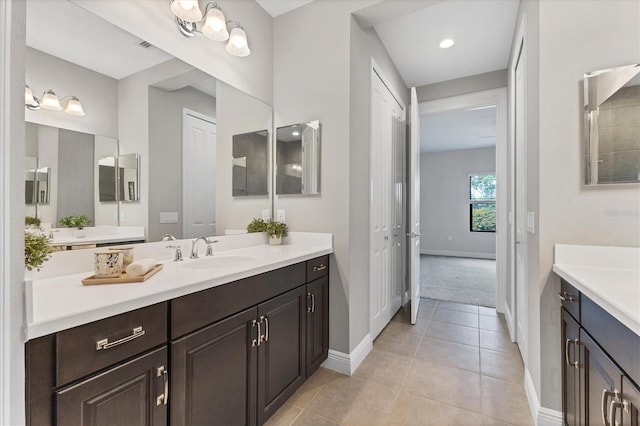 21649 Avon Park Ct, Venice, FL 34293 - bathroom with baseboards, vanity, and tile patterned flooring