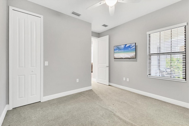 21649 Avon Park Ct, Venice, FL 34293 - unfurnished bedroom featuring carpet flooring, baseboards, and a ceiling fan