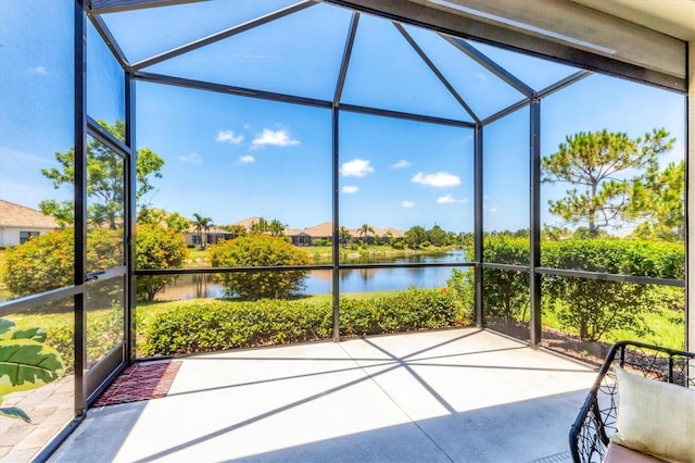 21649 Avon Park Ct, Venice, FL 34293 - unfurnished sunroom featuring a water view and a residential view