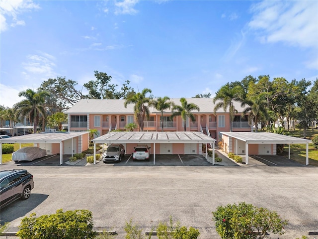 458 Cerromar Rd Unit 382, Venice, FL 34293 - view of front facade with covered parking and a tiled roof