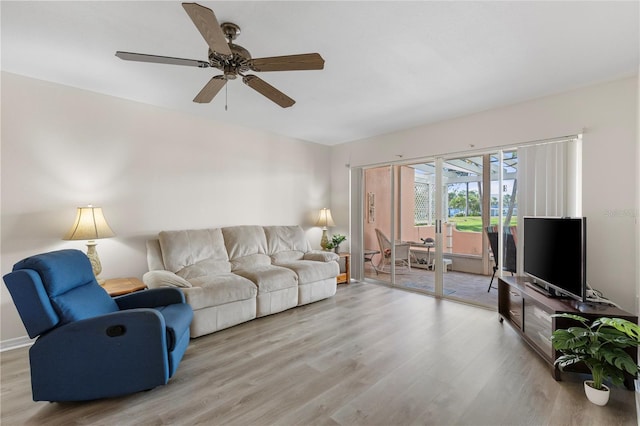458 Cerromar Rd Unit 382, Venice, FL 34293 - living room with light wood-style floors and a ceiling fan