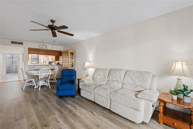 458 Cerromar Rd Unit 382, Venice, FL 34293 - living area with a ceiling fan and light wood-type flooring