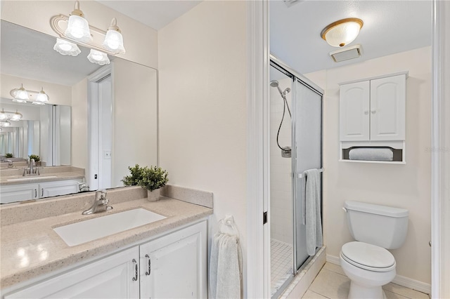 458 Cerromar Rd Unit 382, Venice, FL 34293 - full bathroom with a shower stall, toilet, tile patterned floors, vanity, and baseboards
