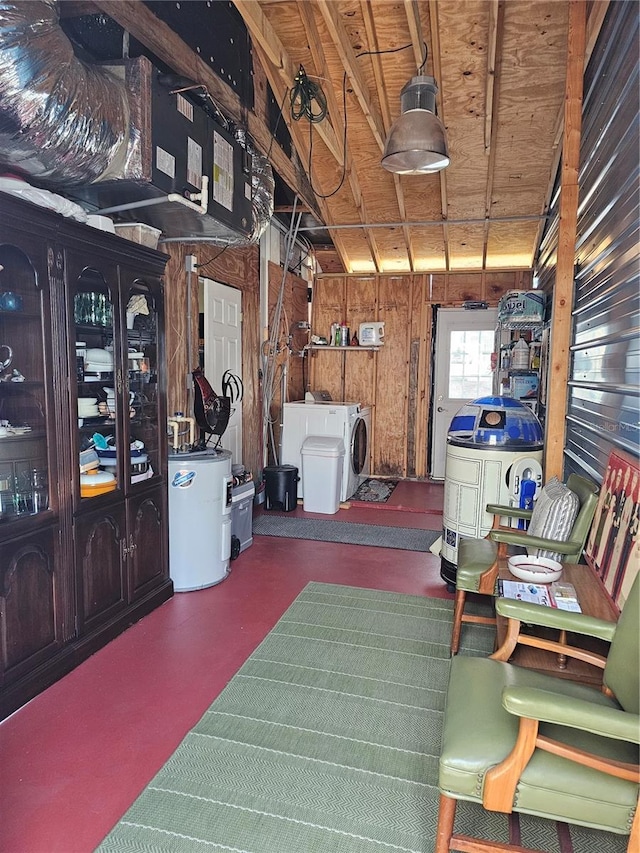1103 Lucille Ave, Nokomis, FL 34275 - garage featuring washing machine and dryer, water heater, and wooden walls