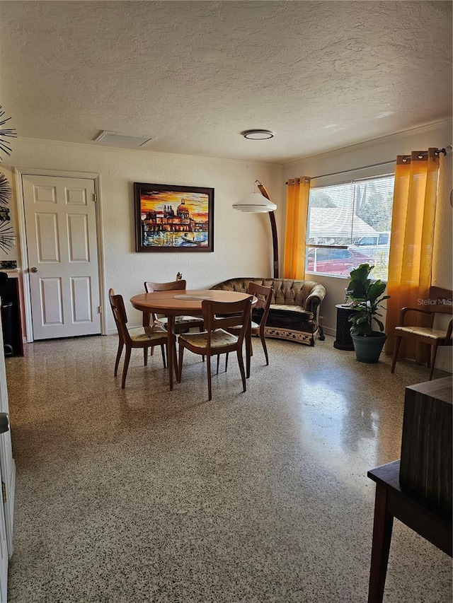 1103 Lucille Ave, Nokomis, FL 34275 - dining area featuring a textured ceiling and speckled floor