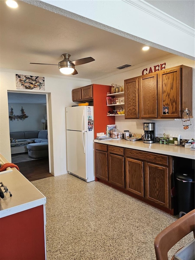 1103 Lucille Ave, Nokomis, FL 34275 - kitchen with freestanding refrigerator, light countertops, a ceiling fan, open shelves, and baseboards