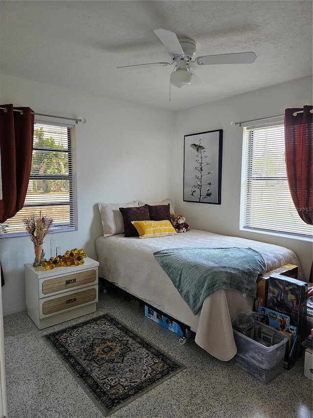 1103 Lucille Ave, Nokomis, FL 34275 - bedroom with a textured ceiling, a ceiling fan, and speckled floor