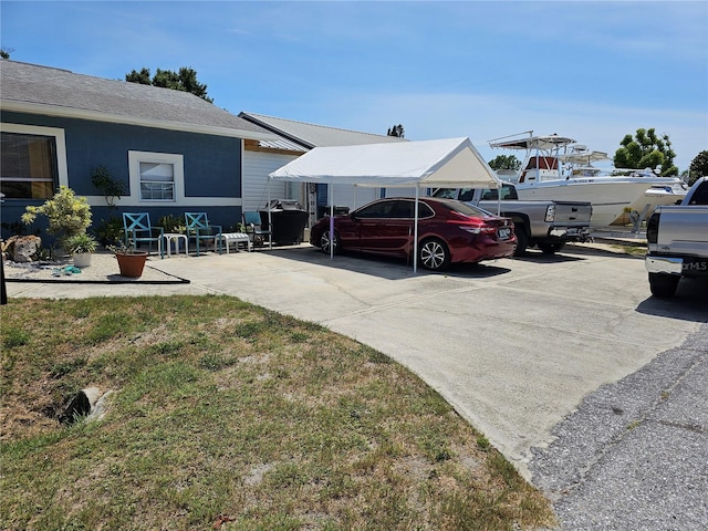 1103 Lucille Ave, Nokomis, FL 34275 - view of yard with a carport and driveway