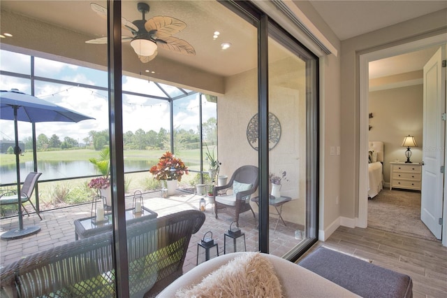 10410 Inglenook Ter, Palmetto, FL 34221 - sunroom featuring ceiling fan and a water view