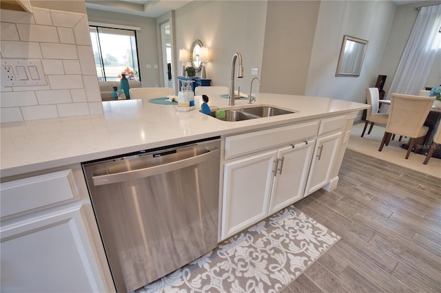 10410 Inglenook Ter, Palmetto, FL 34221 - kitchen with dishwasher, a sink, light wood-type flooring, and white cabinets