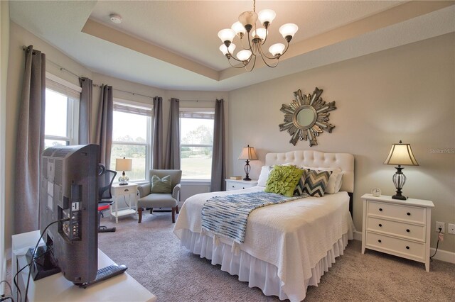 10410 Inglenook Ter, Palmetto, FL 34221 - carpeted bedroom with a chandelier and a tray ceiling