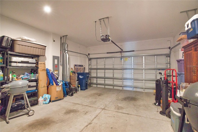 10410 Inglenook Ter, Palmetto, FL 34221 - garage featuring electric panel and a garage door opener