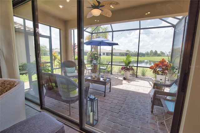10410 Inglenook Ter, Palmetto, FL 34221 - sunroom / solarium with a ceiling fan, a water view, and plenty of natural light