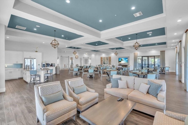 10410 Inglenook Ter, Palmetto, FL 34221 - living area with wood finished floors, coffered ceiling, recessed lighting, beamed ceiling, and crown molding