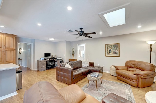 1515 Pecan St, Nokomis, FL 34275 - living room featuring a desk, a skylight, baseboards, light wood-style flooring, and recessed lighting