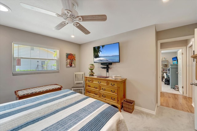 1515 Pecan St, Nokomis, FL 34275 - bedroom with baseboards, light carpet, and ceiling fan