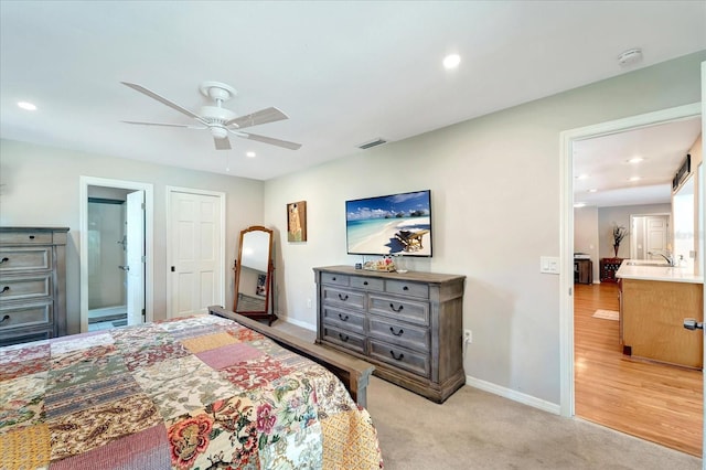 1515 Pecan St, Nokomis, FL 34275 - bedroom featuring baseboards, recessed lighting, a sink, connected bathroom, and light colored carpet