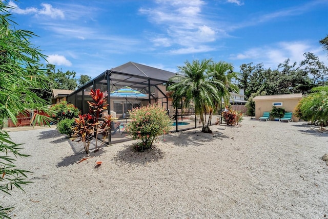1515 Pecan St, Nokomis, FL 34275 - rear view of house featuring a patio area, a lanai, and an outdoor pool