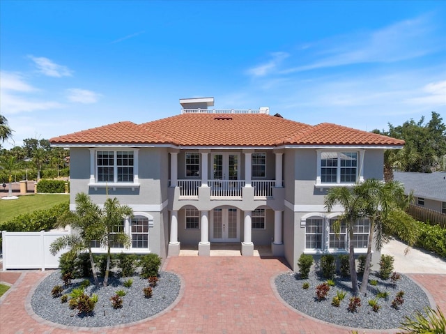 2322 Bayshore Rd, Nokomis, FL 34275 - mediterranean / spanish-style home featuring french doors, stucco siding, a balcony, and a tile roof