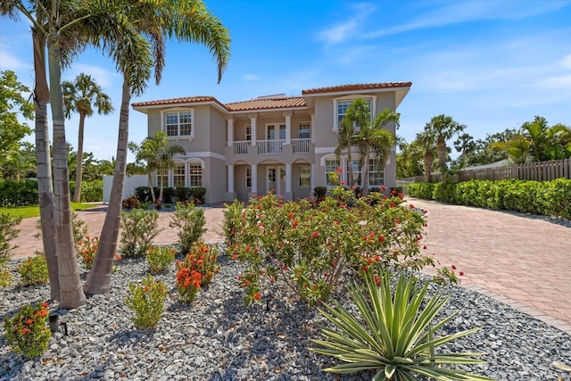 2322 Bayshore Rd, Nokomis, FL 34275 - mediterranean / spanish home featuring a balcony, a tiled roof, and stucco siding