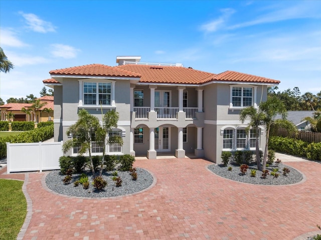 2322 Bayshore Rd, Nokomis, FL 34275 - mediterranean / spanish-style house featuring french doors, stucco siding, a tiled roof, and a balcony