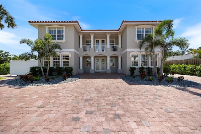 2322 Bayshore Rd, Nokomis, FL 34275 - mediterranean / spanish-style house with french doors, a balcony, stucco siding, and a tile roof