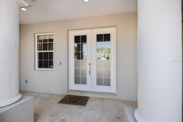 2322 Bayshore Rd, Nokomis, FL 34275 - entrance to property with french doors and stucco siding