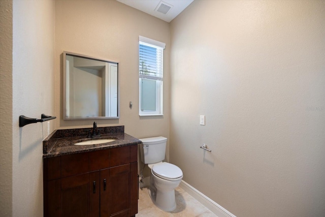 2322 Bayshore Rd, Nokomis, FL 34275 - half bathroom with toilet, baseboards, vanity, and tile patterned floors