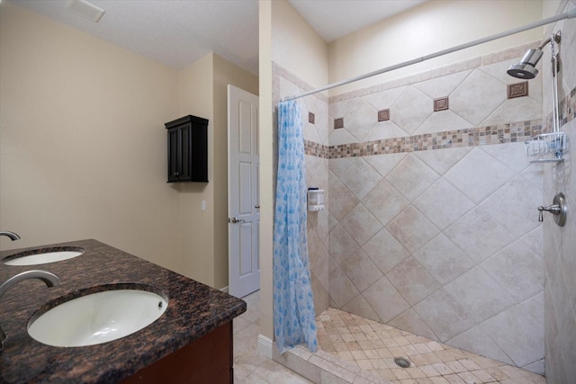 2322 Bayshore Rd, Nokomis, FL 34275 - full bath with a stall shower, double vanity, and tile patterned floors