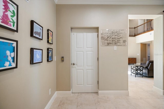 2322 Bayshore Rd, Nokomis, FL 34275 - hallway with baseboards, light tile patterned flooring, and crown molding
