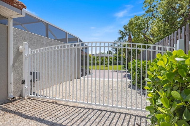 2322 Bayshore Rd, Nokomis, FL 34275 - gate with a fenced backyard and a lanai