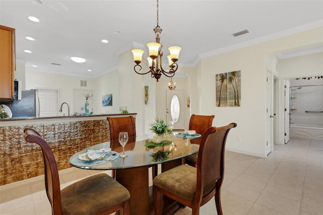 2104 Batello Dr, Venice, FL 34292 - dining space with light tile patterned flooring, recessed lighting, a chandelier, crown molding, and baseboards