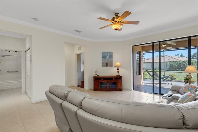 2104 Batello Dr, Venice, FL 34292 - living area featuring a ceiling fan, light tile patterned floors, ornamental molding, and baseboards