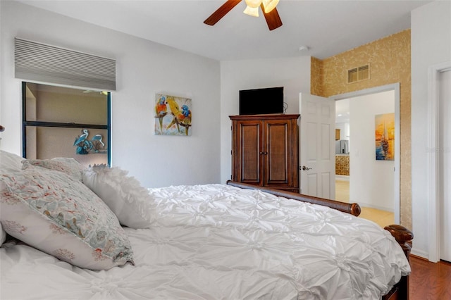 2104 Batello Dr, Venice, FL 34292 - bedroom with ceiling fan and wood finished floors