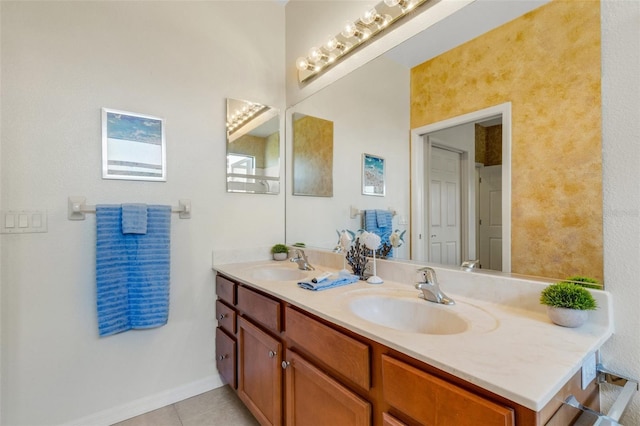2104 Batello Dr, Venice, FL 34292 - full bathroom featuring double vanity, tile patterned floors, and baseboards