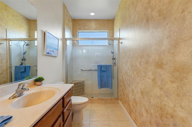 2104 Batello Dr, Venice, FL 34292 - full bathroom with toilet, vanity, a stall shower, and tile patterned flooring