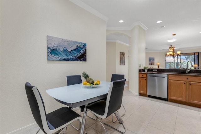 2104 Batello Dr, Venice, FL 34292 - dining room with crown molding, baseboards, arched walkways, light tile patterned flooring, and recessed lighting
