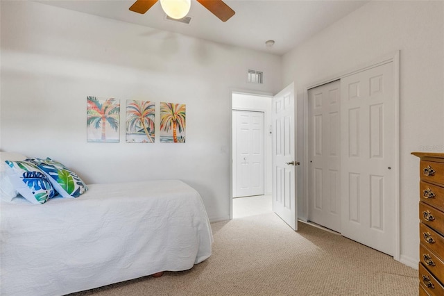 2104 Batello Dr, Venice, FL 34292 - bedroom featuring carpet floors, a closet, and a ceiling fan