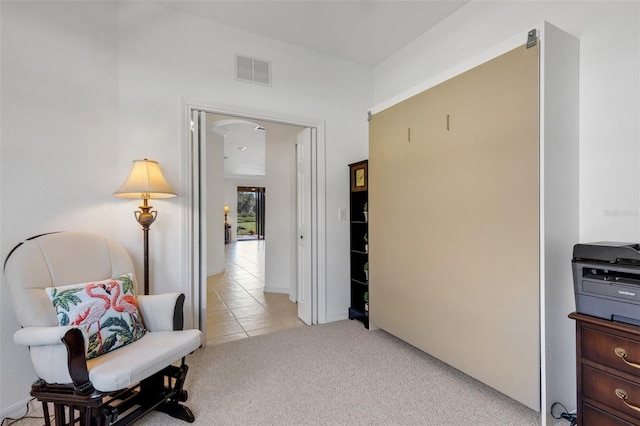 2104 Batello Dr, Venice, FL 34292 - corridor with light tile patterned flooring and light colored carpet