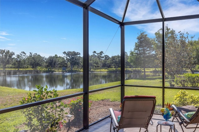2104 Batello Dr, Venice, FL 34292 - sunroom / solarium featuring a water view and view of wooded area