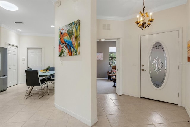 2104 Batello Dr, Venice, FL 34292 - foyer featuring a chandelier, crown molding, light tile patterned floors, baseboards, and recessed lighting