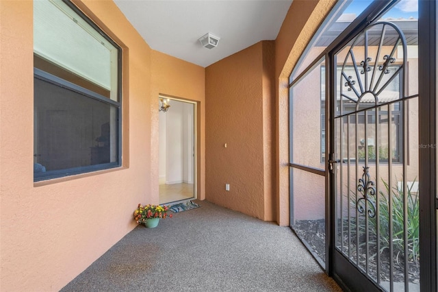 2104 Batello Dr, Venice, FL 34292 - doorway to property with stucco siding