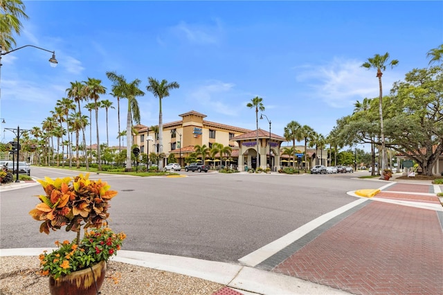 2104 Batello Dr, Venice, FL 34292 - view of asphalt street with street lighting, sidewalks, and curbs